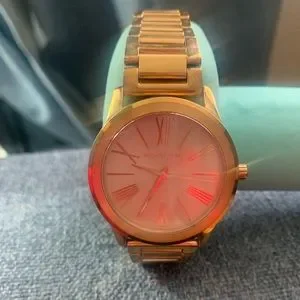 Woman’s rose gold Michael kors watch